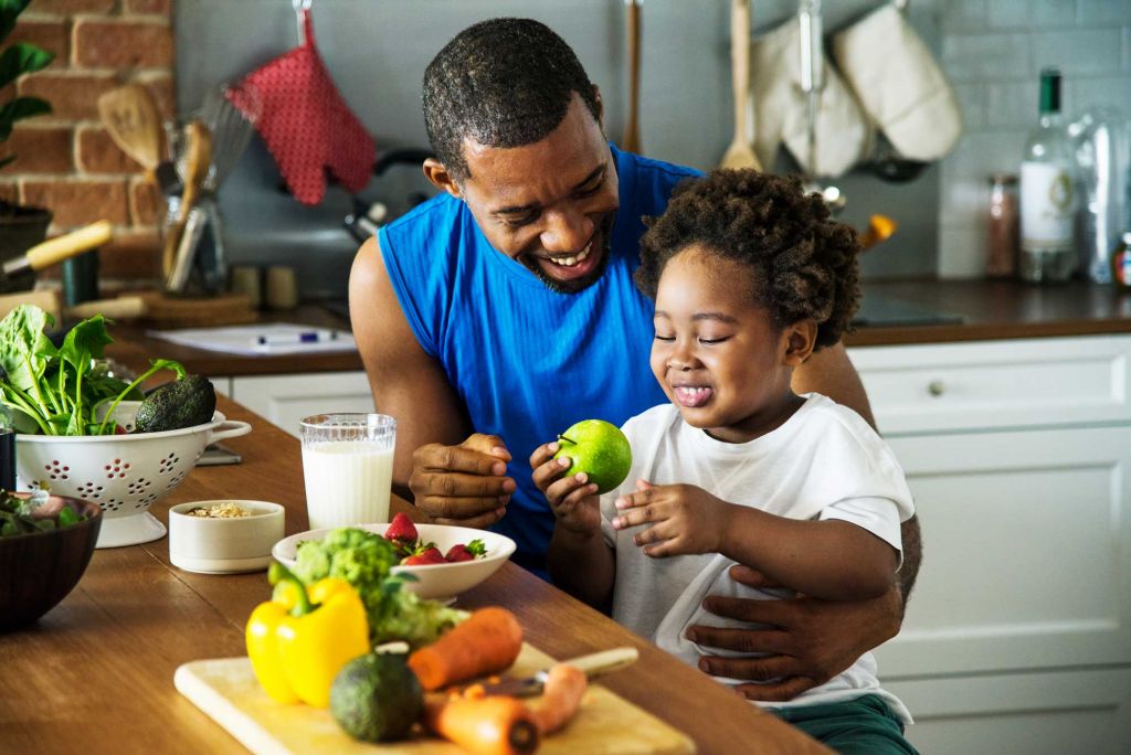 Father cooking with son